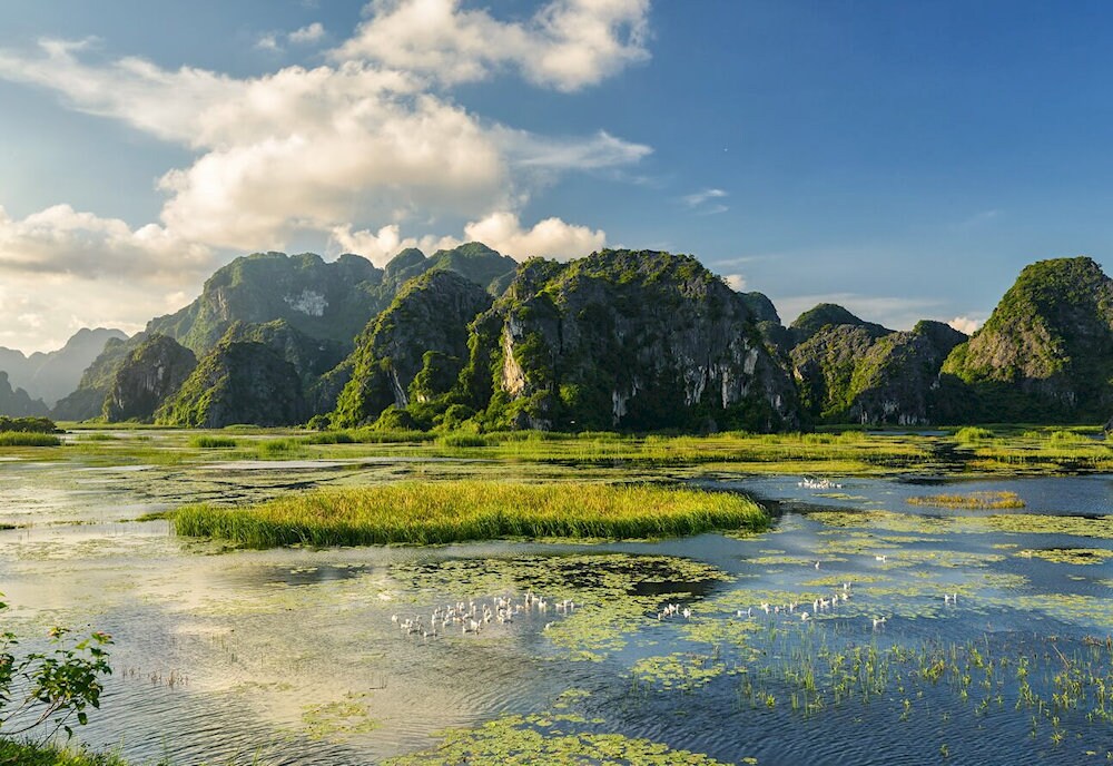 The dry season from November to April is the best time to explore Van Long, with cool weather perfect for outdoor activities